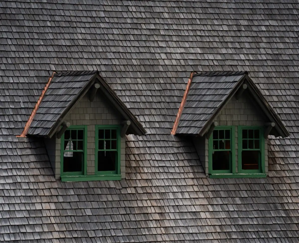 Dormers on a shingle roof in Pasco, WA, where step flashing and kickout flashing carry water past the walls